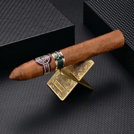 CigarLoong CS-002 brass-tone interlocking stainless steel cigar rest holding a cigar