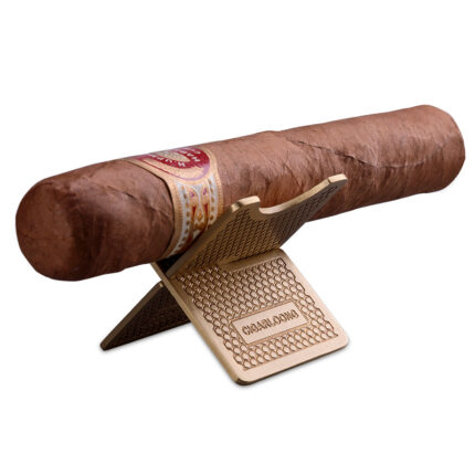 CigarLoong CS-009 gold honeycomb copper cigar rest holding a cigar