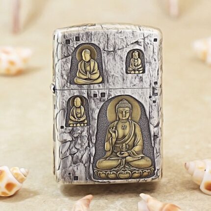 Silver-plated Zippo Armor lighter with grotto Buddha engraving and gold accents