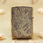 Phoenix artwork with sweeping wings on the brass Zippo Armor lighter
