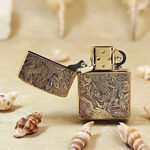 Feather-inspired engraving detail on the legendary phoenix Zippo