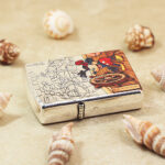Silver relief and decorative linework on the Mickey Mouse Zippo lighter