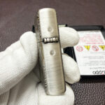 Side engraving detail on the silver Guanyin Zippo Armor case