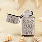 Open Zippo Slim arabesque jacket lighter showing the front pattern