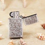 Open Zippo Slim arabesque jacket lighter showing the reverse pattern