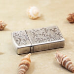 Closed Zippo Slim arabesque engraved jacket lighter