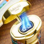 Close-up of the LUBINSKI YJA-80034 dual-jet cigar lighter with two blue flames