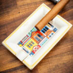 LUBINSKI YJA-80034 Colorful Houses bone china ashtray holding a cigar