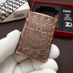 Zippo 29736 Tiki Design Antique Copper Armor lighter close-up