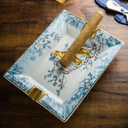 LUBINSKI AS-420 snow leopard bone china dual-slot cigar ashtray in use