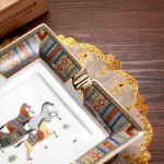 CigarLoong CL-002 ceramic cigar ashtray close-up of patterned border and gold-tone cigar rest
