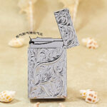 Karl Wieden KW-T021056B open butane lighter showing gas outlet and chrome-plated Arabesque design