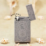 Karl Wieden KW-T0211C open petrol lighter showing wick-style mechanism and antique silver-tone Pixiu design