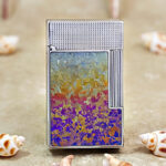 Karl Wieden Silver Ice Flower petrol lighter KW-T024A front view with purple yellow and white accents