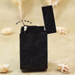 Karl Wieden KW-T0293C open petrol lighter showing wick-style mechanism and black auspicious-symbol design