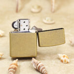 Zippo Classic antique brass-tone LOVE lighter open reverse view