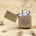 Zippo Classic fingerprint lighter open showing windproof petrol insert