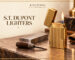 Gold-tone luxury lighter with an open lid and flame on a craftsmanship workbench