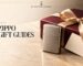 Windproof lighter beside a burgundy gift box with a champagne ribbon