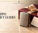 Windproof lighter beside a burgundy gift box with a champagne ribbon